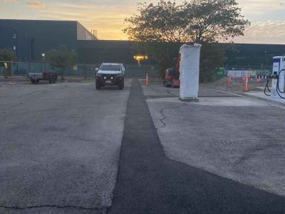 Service station asphalt resurfacing over trench Townsville