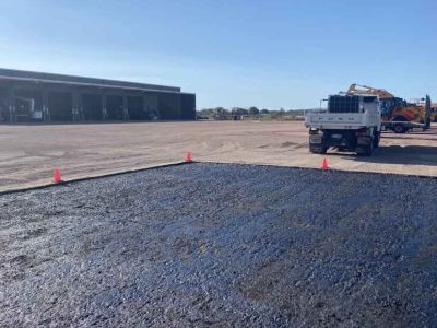 Asphalt patch repair with earthworks for drainage protection at depot