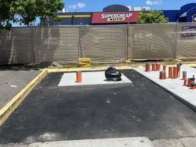 New asphalt surface with line marking at electric vehicle station