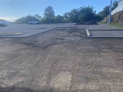 Asphalt paving contractors repairing shopping centre carpark