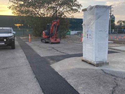 Asphalt patch repair over trenching at service station Fairfield Waters